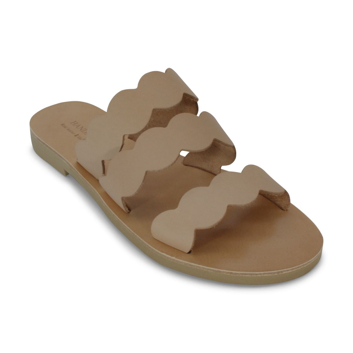 Beige flat slide sandal with three cream cloud-shaped straps across the top of the foot