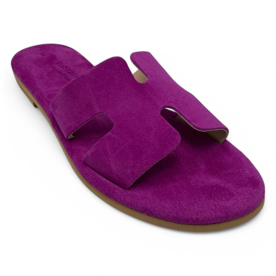 Purple Suede Slide Sandal with Two Wide Straps and a Cutout Notch at the Top on a Brown Sole