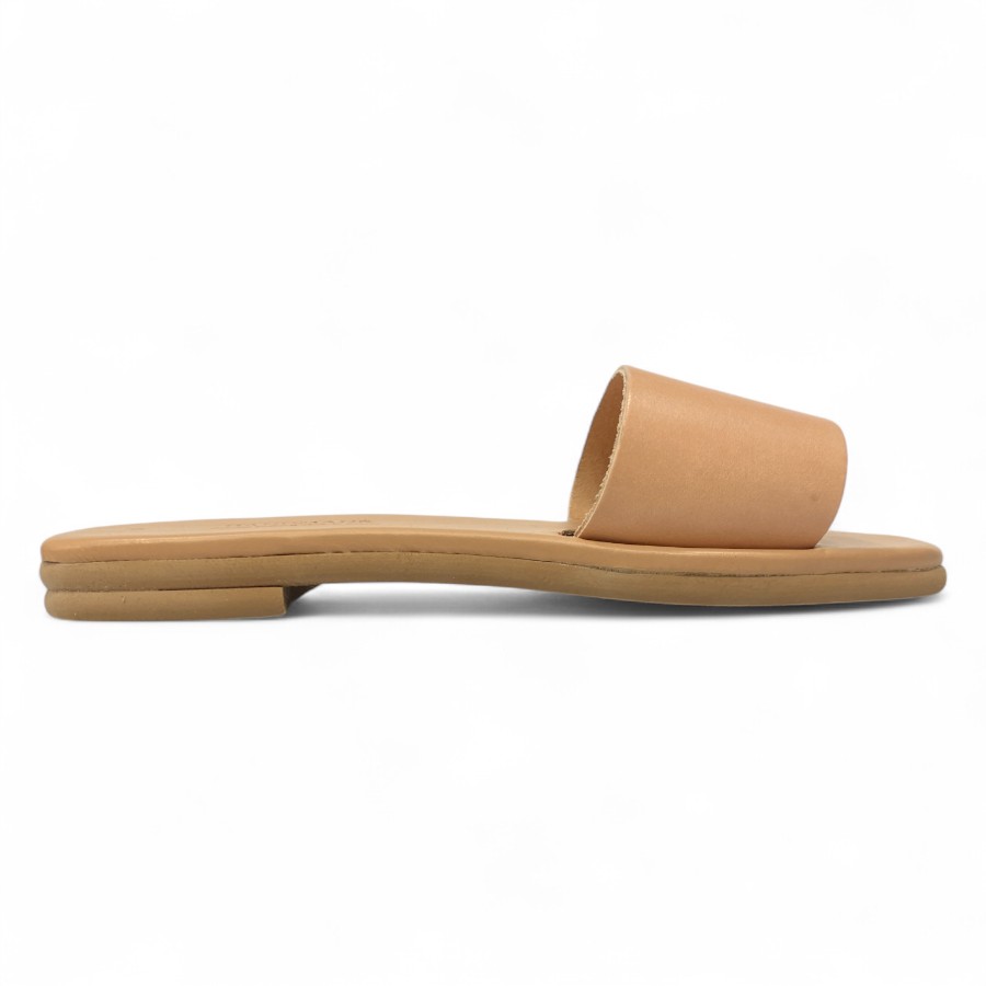 Tan Leather Slide Sandal with a Wide Strap on a Flat Sole Shown in Profile on a White Background
